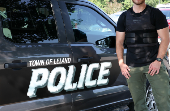 Town of Police Employee in Bulletproof Vest