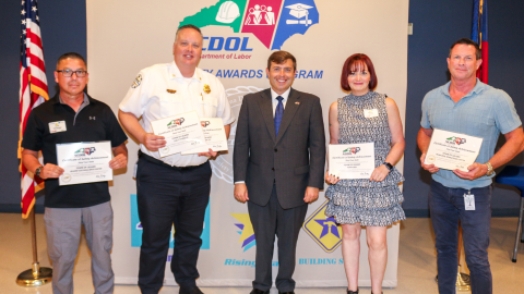 4 staff members recieveing the N.C. Department of Labor Safety Awards